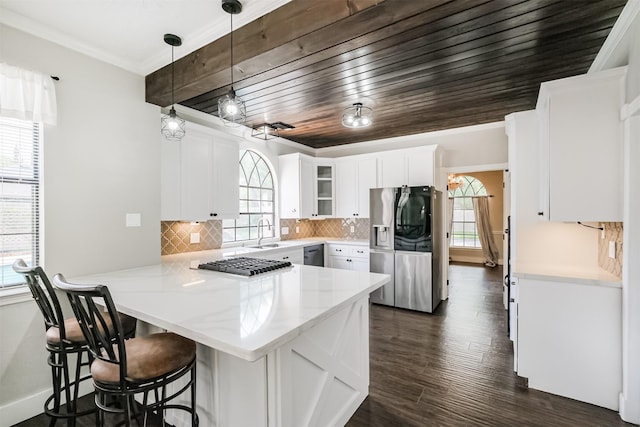 10402 Hondo Hill Rd, Houston, TX 77064 - kitchen with a peninsula, stainless steel appliances, a sink, white cabinetry, and backsplash