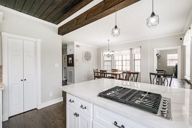 10402 Hondo Hill Rd, Houston, TX 77064 - kitchen featuring stainless steel gas cooktop, dark wood-style flooring, baseboards, white cabinetry, and decorative light fixtures