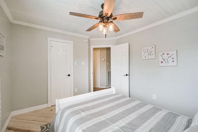 10402 Hondo Hill Rd, Houston, TX 77064 - bedroom with light wood-style floors, crown molding, ceiling fan, and baseboards