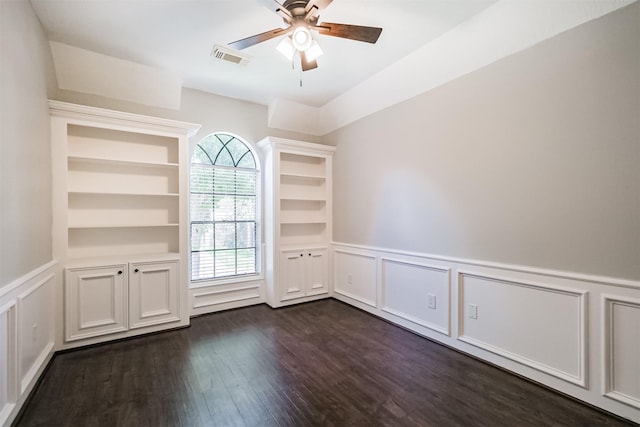 10402 Hondo Hill Rd, Houston, TX 77064 - unfurnished room featuring a decorative wall, dark wood finished floors, ceiling fan, and a wainscoted wall