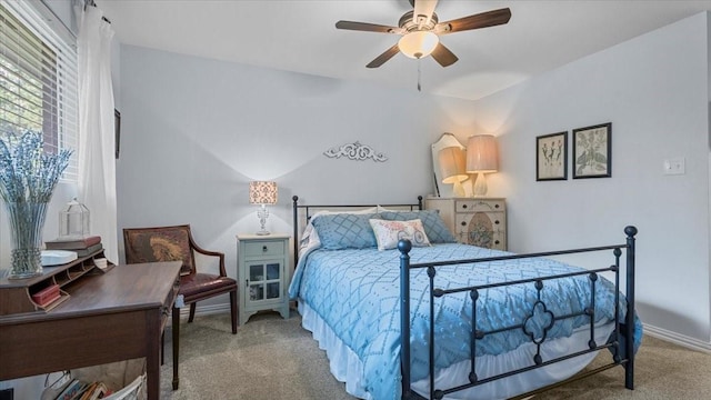 1925 Foxbriar Dr, Huntsville, TX 77340 - carpeted bedroom with a ceiling fan and baseboards
