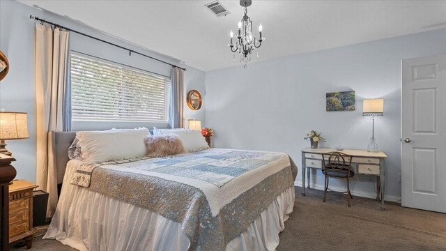1925 Foxbriar Dr, Huntsville, TX 77340 - carpeted bedroom featuring a chandelier and baseboards