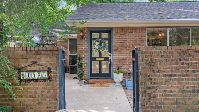 1925 Foxbriar Dr, Huntsville, TX 77340 - entrance to property featuring roof with shingles and brick siding