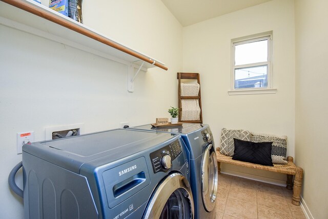 1638 Brookstone Ln, Sugar Land, TX 77479 - laundry area with independent washer and dryer, baseboards, and light tile patterned flooring