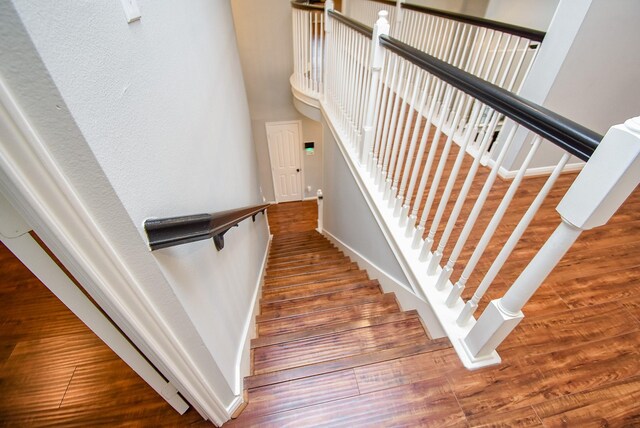 1638 Brookstone Ln, Sugar Land, TX 77479 - stairway featuring wood finished floors and baseboards