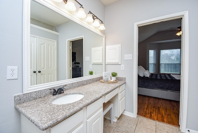 1638 Brookstone Ln, Sugar Land, TX 77479 - bathroom with vanity, tile patterned floors, baseboards, and a ceiling fan