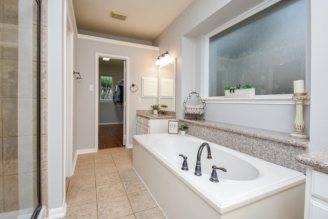 1638 Brookstone Ln, Sugar Land, TX 77479 - bathroom with a bath, vanity, a stall shower, and tile patterned flooring