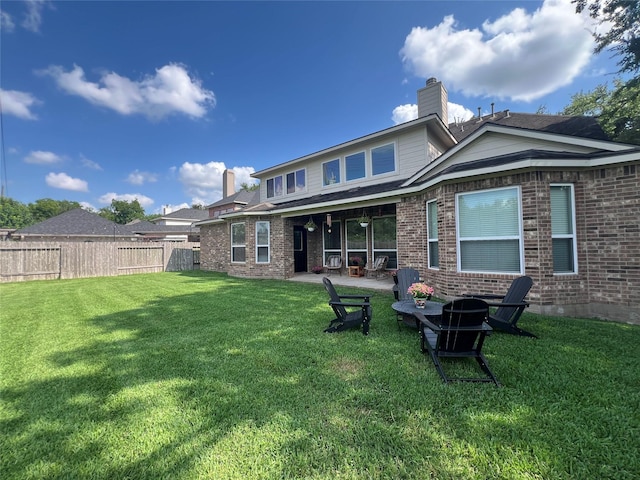 1638 Brookstone Ln, Sugar Land, TX 77479 - back of house featuring brick siding, a patio area, and a chimney