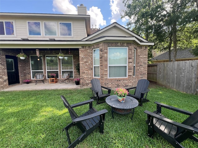 1638 Brookstone Ln, Sugar Land, TX 77479 - back of property with a patio area, brick siding, and a chimney