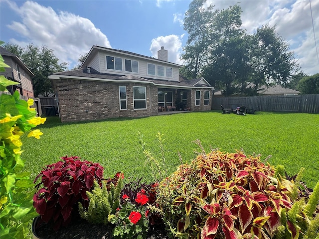 1638 Brookstone Ln, Sugar Land, TX 77479 - rear view of property with a chimney and brick siding