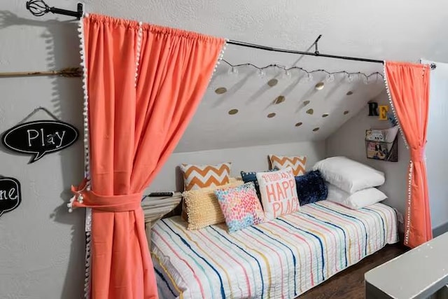 1017 Milner, College Station, TX 77840 - bedroom featuring lofted ceiling and wood finished floors