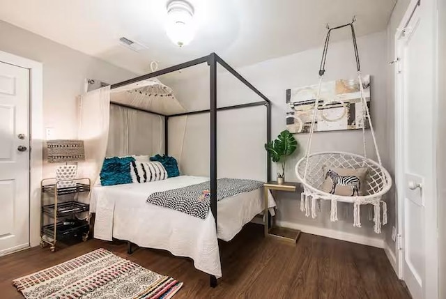 1017 Milner, College Station, TX 77840 - bedroom with wood finished floors and baseboards
