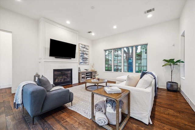 523 E 23rd St, Houston, TX 77008 - living area featuring baseboards, a fireplace, recessed lighting, and wood finished floors