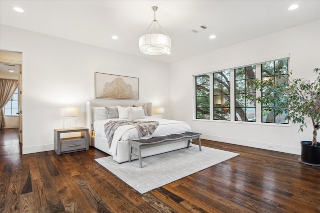523 E 23rd St, Houston, TX 77008 - bedroom featuring multiple windows, dark wood finished floors, baseboards, and recessed lighting