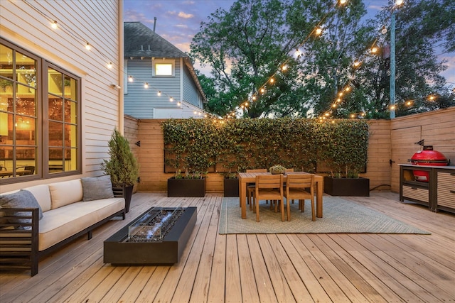 523 E 23rd St, Houston, TX 77008 - wooden terrace featuring an outdoor living space with a fire pit and outdoor dining space