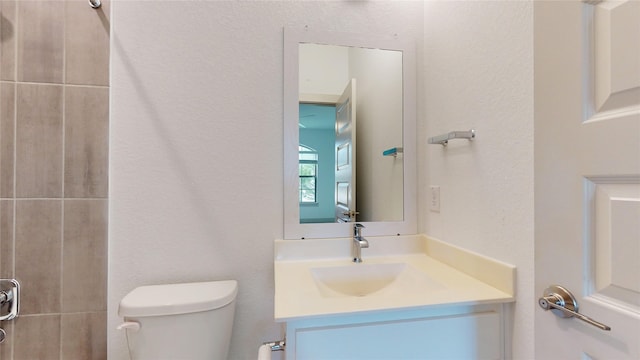 3539 Gore Creek Dr, Katy, TX 77494 - bathroom with toilet, vanity, and a textured wall