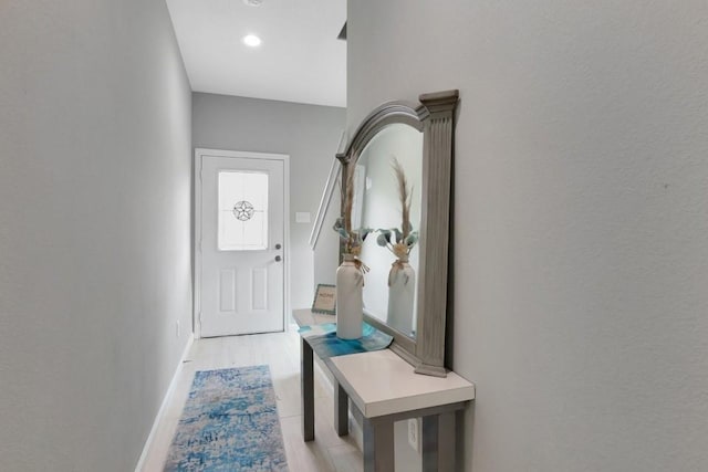 414 Armstrong St, Houston, TX 77029 - doorway featuring light wood-style flooring and baseboards