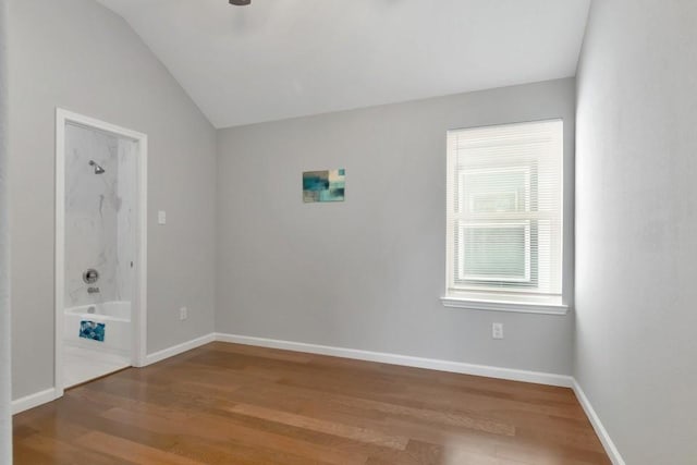 414 Armstrong St, Houston, TX 77029 - unfurnished room featuring lofted ceiling, wood finished floors, and baseboards