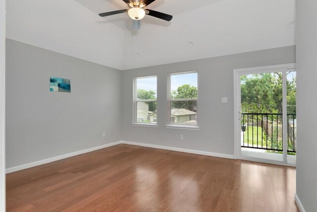 414 Armstrong St, Houston, TX 77029 - empty room with wood finished floors, baseboards, lofted ceiling, and ceiling fan