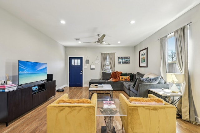 7015 Roswell St, Houston, TX 77022 - living room with light wood-style flooring, recessed lighting, and ceiling fan