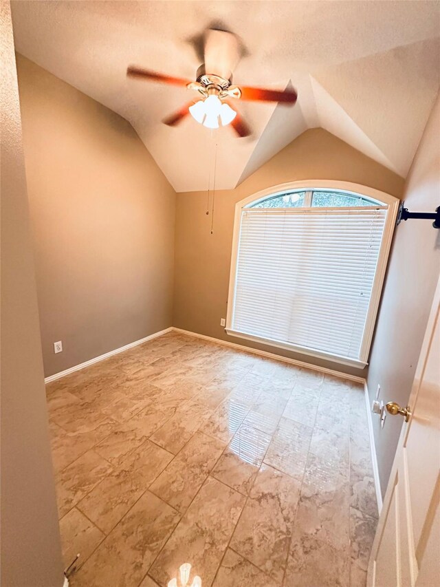 4306 Dow Way, Pasadena, TX 77505 - spare room with lofted ceiling, a ceiling fan, and baseboards