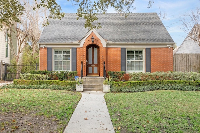 4006 University Blvd, West University Place, TX 77005 - view of front facade with brick siding and roof with shingles