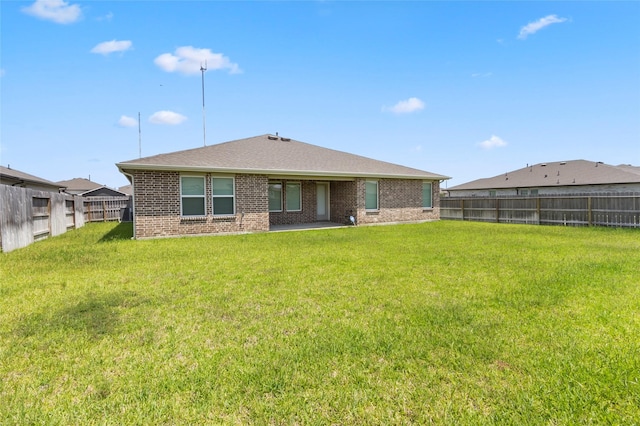 3434 Harper Meadow Ln, Missouri City, TX 77459 - rear view of property featuring brick siding and roof with shingles