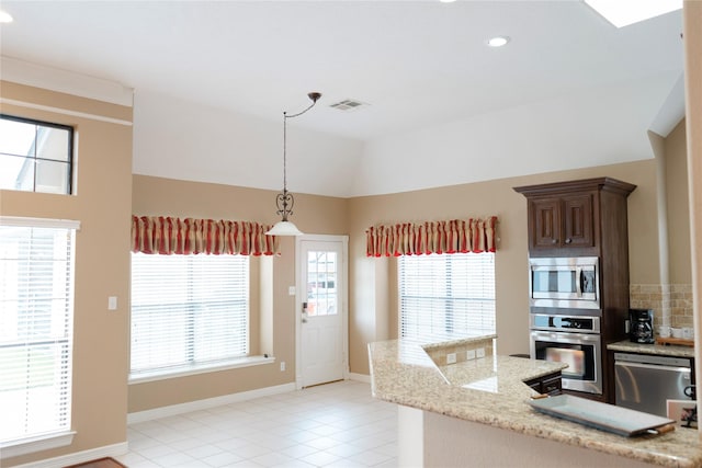 1818 Janell Rene Cir, Deer Park, TX 77536 - kitchen featuring appliances with stainless steel finishes, recessed lighting, decorative light fixtures, light tile patterned floors, and vaulted ceiling
