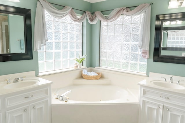1818 Janell Rene Cir, Deer Park, TX 77536 - bathroom featuring two vanities and a jetted tub