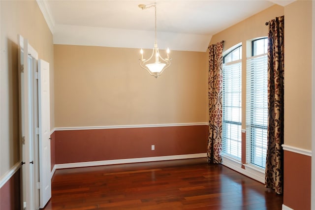 1818 Janell Rene Cir, Deer Park, TX 77536 - empty room featuring wood finished floors, baseboards, a chandelier, and vaulted ceiling