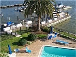 208 Yacht Club Ln, Seabrook, TX 77586 - community pool featuring a water view and a patio area