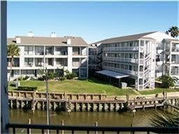 208 Yacht Club Ln, Seabrook, TX 77586 - dock featuring a water view and a lawn
