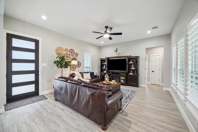 25747 Beaver Run Dr, Huffman, TX 77336 - living area with a ceiling fan, baseboards, light wood-style flooring, and recessed lighting