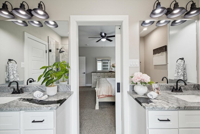 25747 Beaver Run Dr, Huffman, TX 77336 - ensuite bathroom with a stall shower, a ceiling fan, two vanities, and baseboards