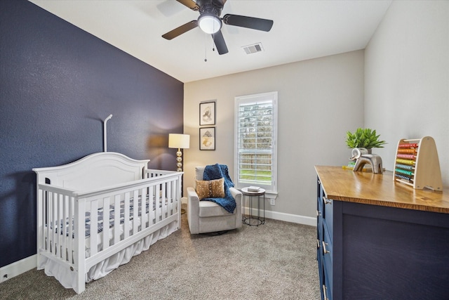 25747 Beaver Run Dr, Huffman, TX 77336 - carpeted bedroom featuring a nursery area, baseboards, and ceiling fan