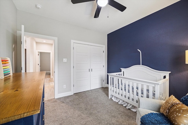 25747 Beaver Run Dr, Huffman, TX 77336 - bedroom with carpet flooring, a closet, a nursery area, ceiling fan, and baseboards