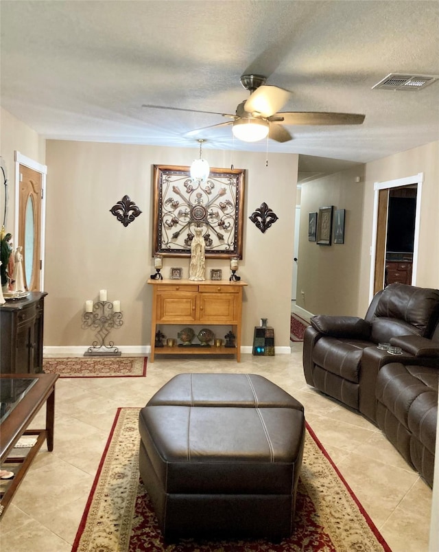 157 Rolling Hills Dr, Conroe, TX 77304 - living room with a ceiling fan, light tile patterned floors, and baseboards
