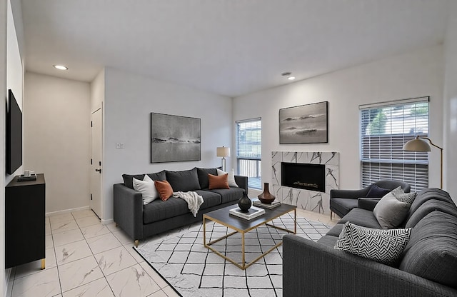 1818 Augusta Dr Unit 3, Houston, TX 77057 - living room with healthy amount of natural light, light marble finish flooring, recessed lighting, a fireplace, and baseboards