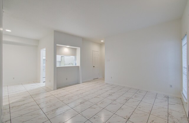 1818 Augusta Dr Unit 3, Houston, TX 77057 - empty room with light marble finish floors and recessed lighting