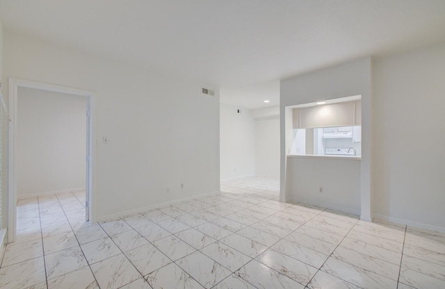 1818 Augusta Dr Unit 3, Houston, TX 77057 - empty room with light marble finish flooring, recessed lighting, and baseboards