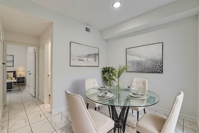 1818 Augusta Dr Unit 3, Houston, TX 77057 - dining area featuring light marble finish floors, baseboards, and recessed lighting