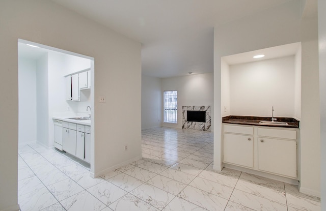 1818 Augusta Dr Unit 3, Houston, TX 77057 - kitchen featuring light marble finish floors and a sink