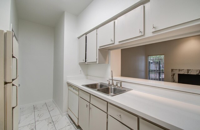 1818 Augusta Dr Unit 3, Houston, TX 77057 - kitchen with a sink, white appliances, light marble finish flooring, light countertops, and baseboards