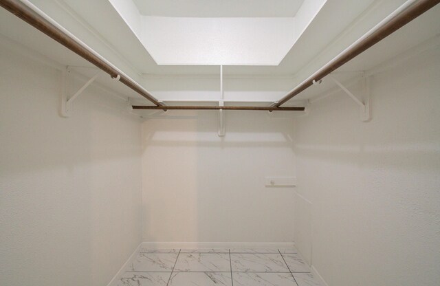 1818 Augusta Dr Unit 3, Houston, TX 77057 - spacious closet featuring light marble finish flooring