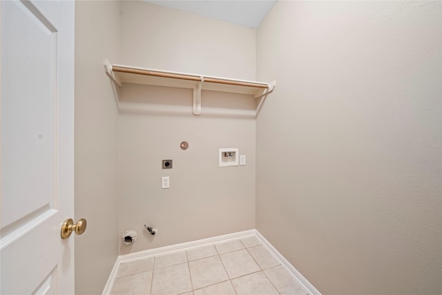 22519 Diamond Shore Ct, Katy, TX 77450 - laundry room featuring hookup for a gas dryer, washer hookup, light tile patterned floors, electric dryer hookup, and baseboards