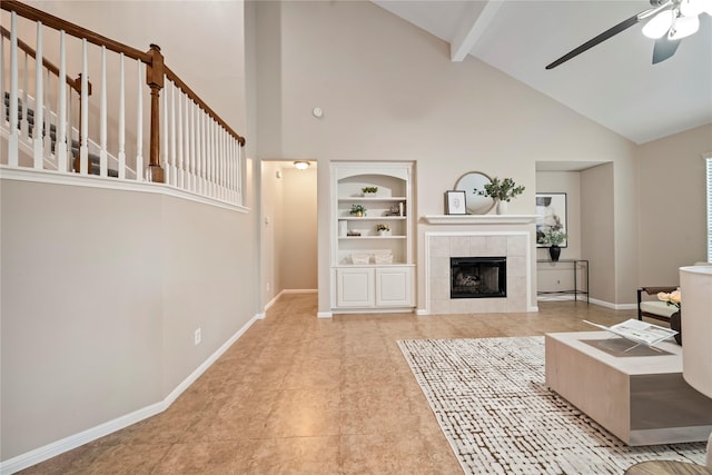22519 Diamond Shore Ct, Katy, TX 77450 - living area with built in shelves, high vaulted ceiling, beamed ceiling, a ceiling fan, and baseboards
