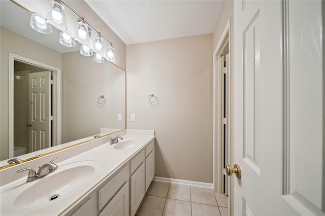 22519 Diamond Shore Ct, Katy, TX 77450 - full bathroom with double vanity, tile patterned floors, and baseboards