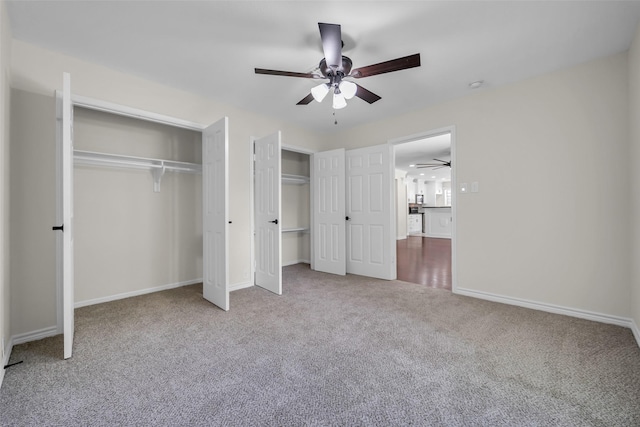 15905 Lakeview Dr, Jersey Village, TX 77040 - unfurnished bedroom featuring multiple closets, carpet flooring, and ceiling fan