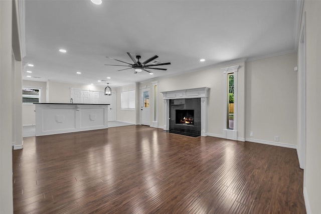 15905 Lakeview Dr, Jersey Village, TX 77040 - unfurnished living room with ceiling fan, a fireplace, ornamental molding, dark wood-style flooring, and recessed lighting