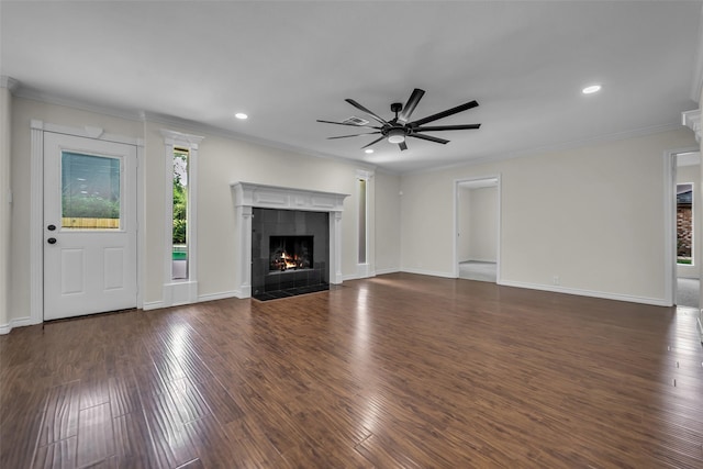 15905 Lakeview Dr, Jersey Village, TX 77040 - unfurnished living room featuring a ceiling fan, a tiled fireplace, crown molding, wood finished floors, and recessed lighting